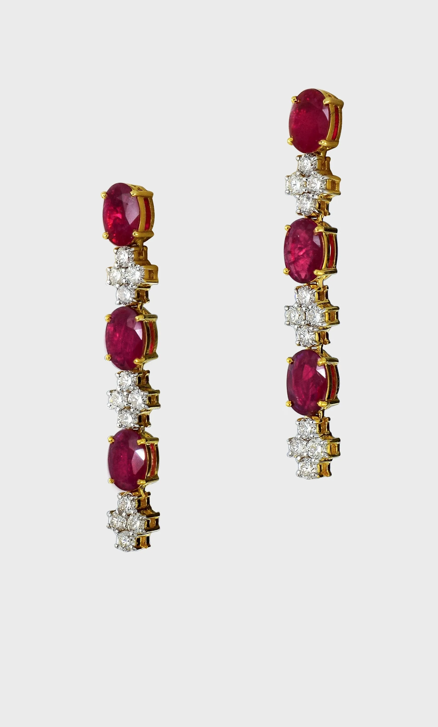 Elegance meets allure with our single line ruby and diamond necklace and earring pair. Crafted to perfection, each piece exudes timeless sophistication and luxury.