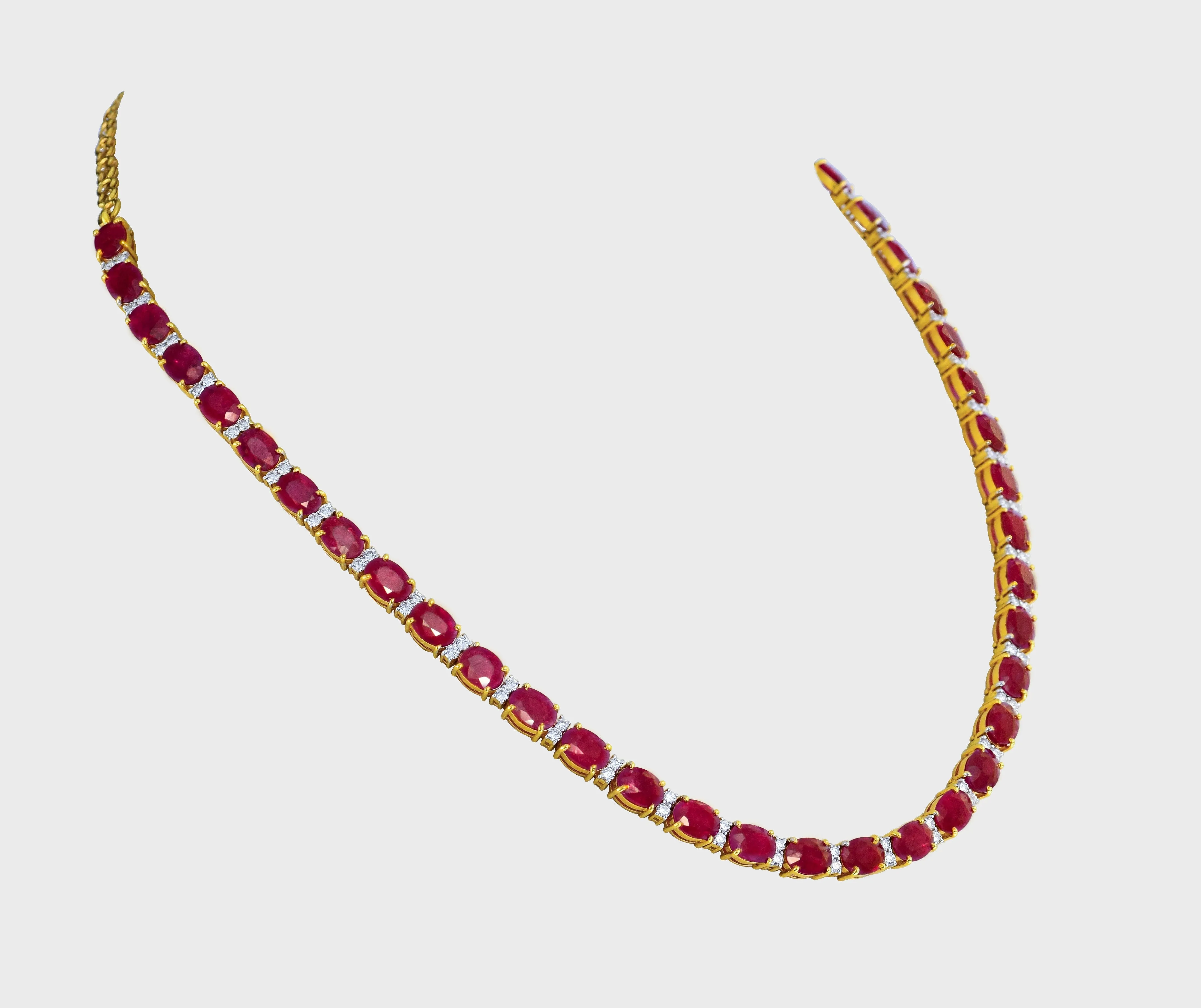 Elegance meets allure with our single line ruby and diamond necklace and earring pair. Crafted to perfection, each piece exudes timeless sophistication and luxury.