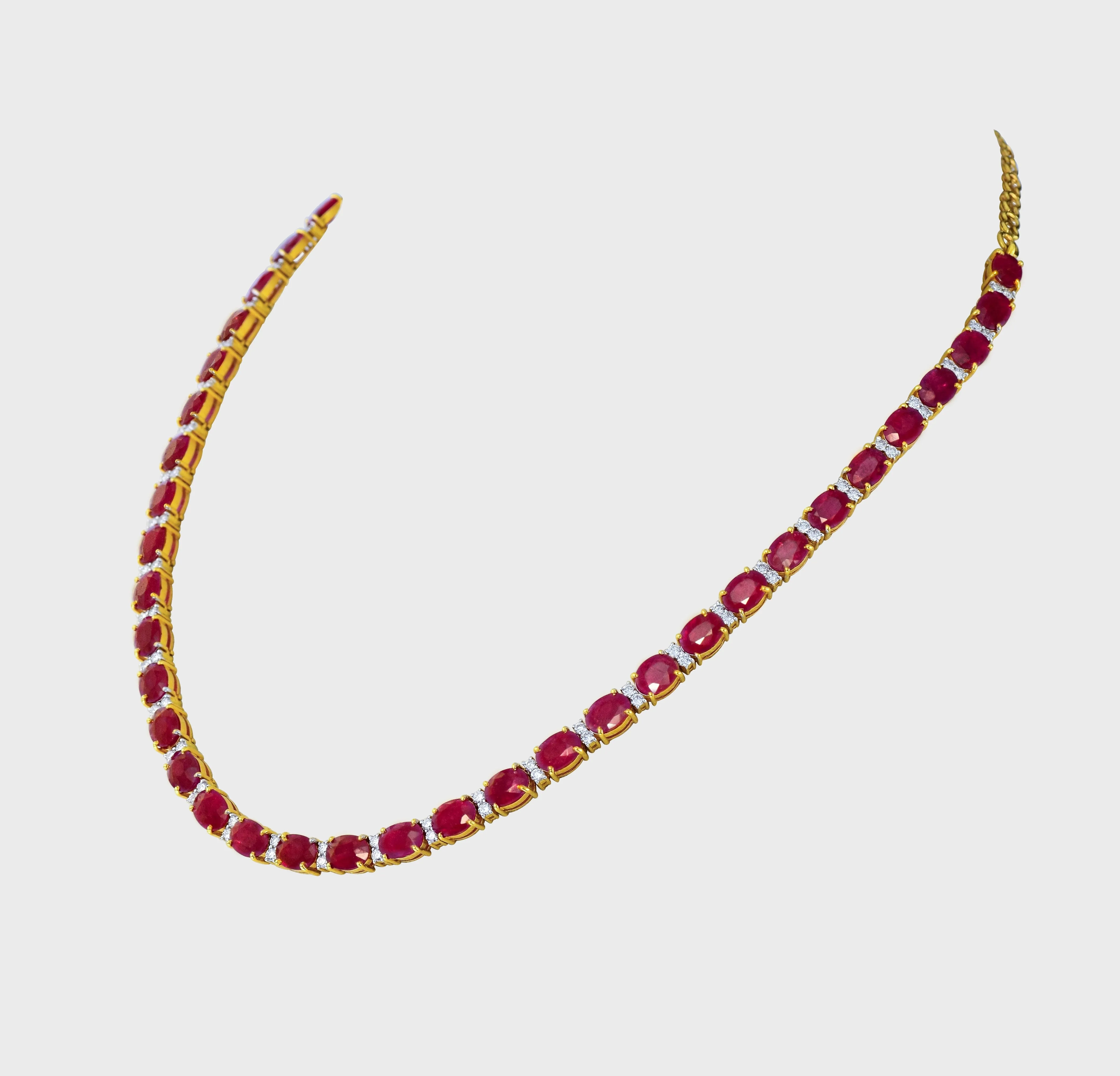 Elegance meets allure with our single line ruby and diamond necklace and earring pair. Crafted to perfection, each piece exudes timeless sophistication and luxury.